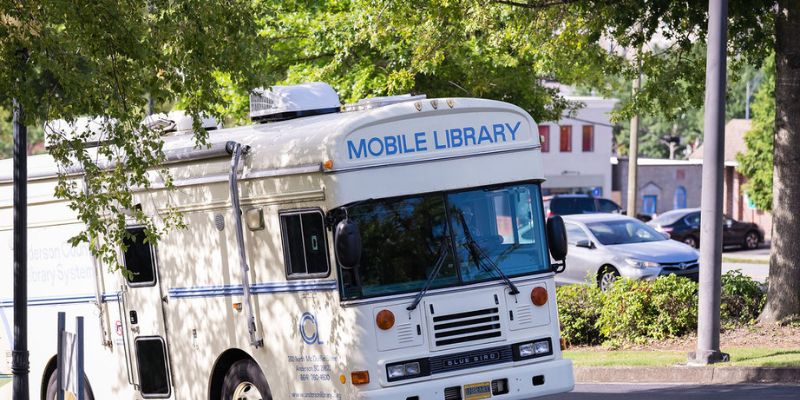 Bookmobile bus vehicle with "Mobile Library" imprint on front