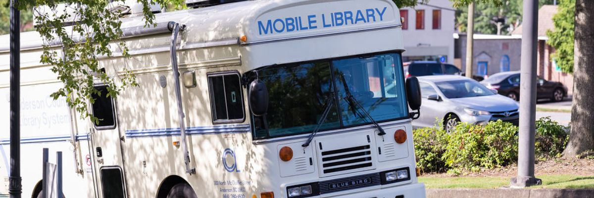 Bookmobile bus vehicle with "Mobile Library" imprint on front