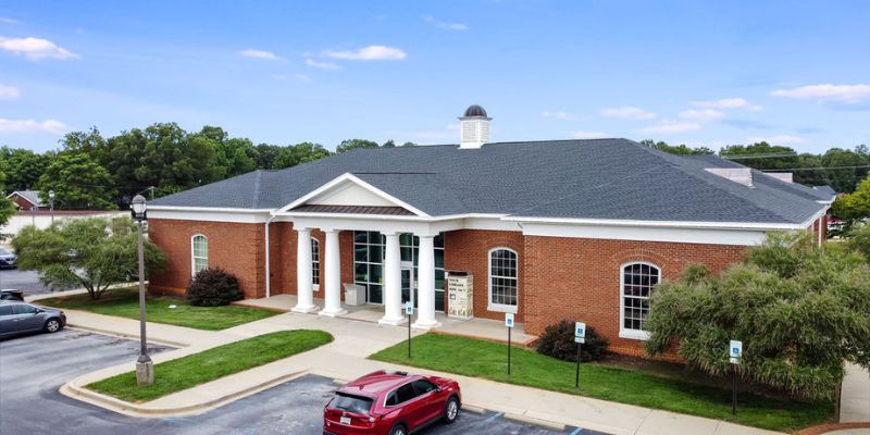 Aerial shot of Powdersville Library building front featuring brick, columns, plinth, and cupola