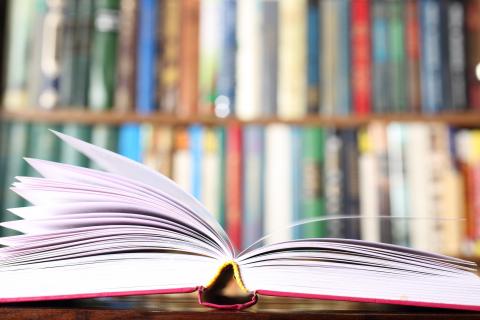 An open book sitting on a desk