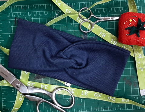 a dark blue fabric headband 