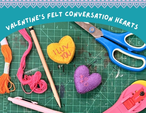 two handsewn felt conversation hearts 