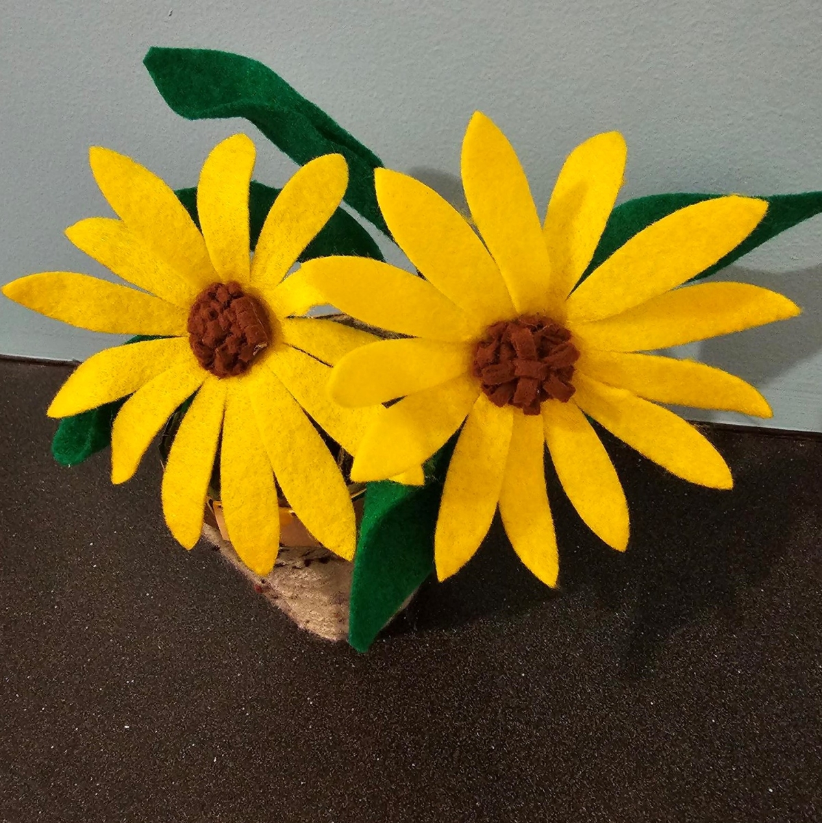 two black-eyed susans made from felt