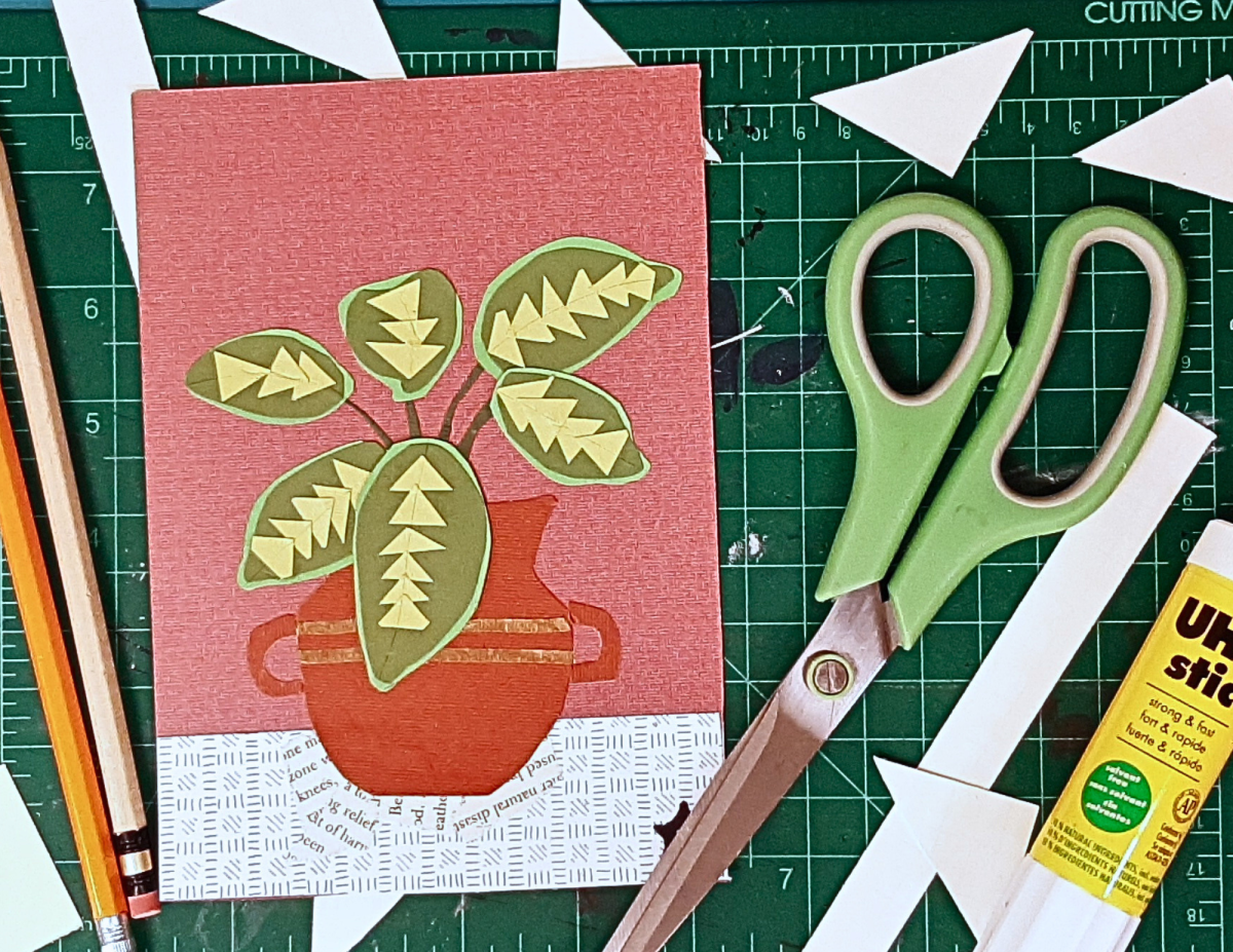 paper collage featuring a plant in a clay pot 